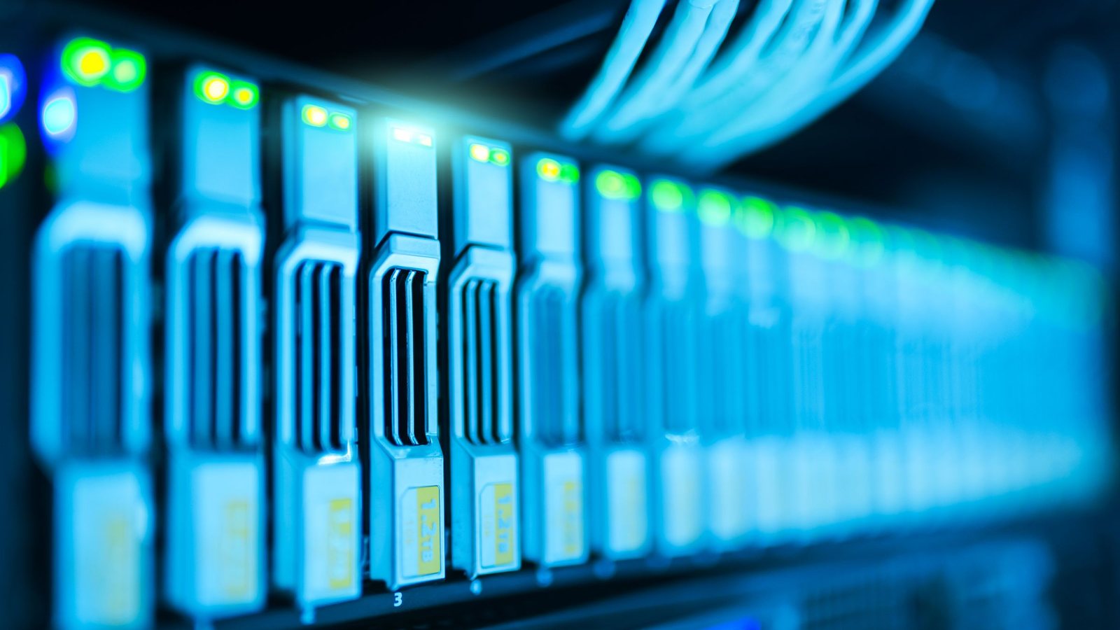 Close-up of server drive bays lit blue inside a rack