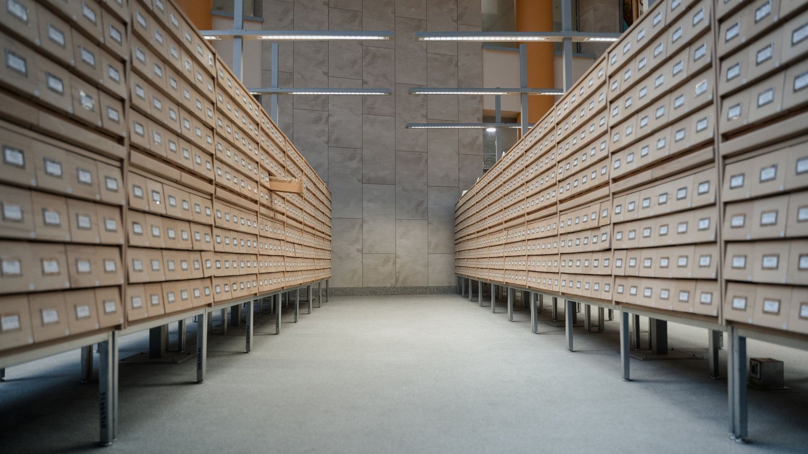 Rows of wooden index-card drawers in an archive