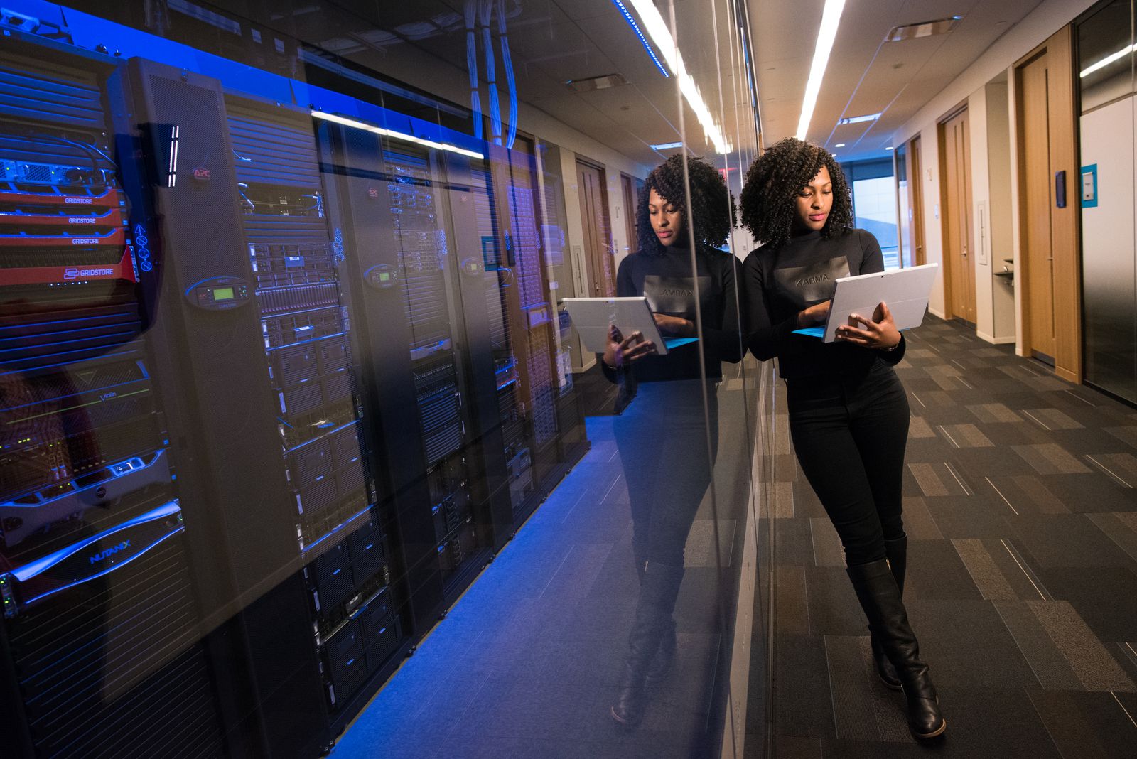 Engineer reviewing cloud and server infrastructure usage on a tablet