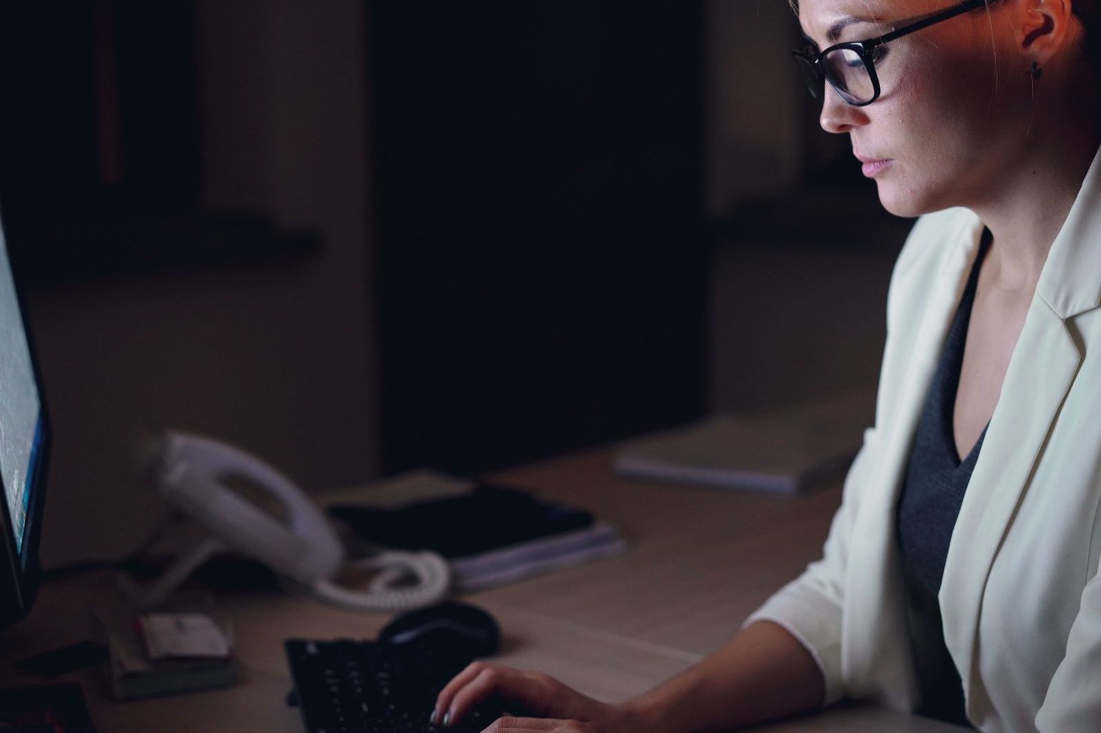 Procurement and finance team working across shared desks